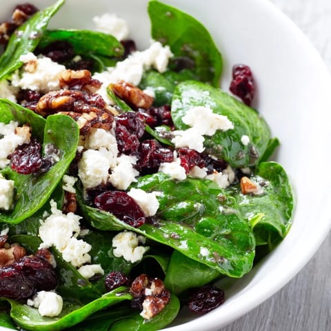 Freshly tossed spinach and goat cheese salad with cranberries and candied pecans, drizzled with homemade balsamic vinaigrette.